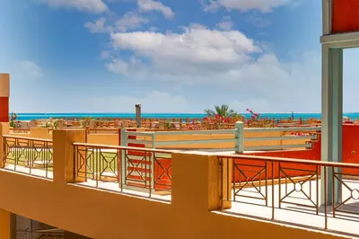 a balcony with a view of the ocean at Cozy Studio 1st Avenue South Side in Hurghada