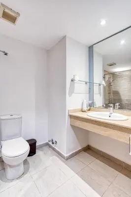 a bathroom with a toilet and a sink at Cozy Studio 1st Avenue South Side in Hurghada