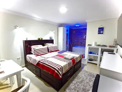 a bedroom with a bed in a room at Fanta Sea Studio with private jacuzzi - Al Ahyaa in Hurghada