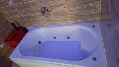 a white bath tub with a faucet in a bathroom at Fanta Sea Studio with private jacuzzi - Al Ahyaa in Hurghada