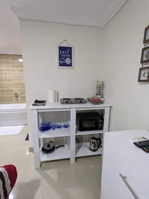 a white shelf in a room with a sink at Fanta Sea Studio with private jacuzzi - Al Ahyaa in Hurghada
