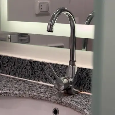a kitchen sink with a faucet on a counter at Vitamin Sea, Beach Front Central Free Wi-Fi in Hurghada
