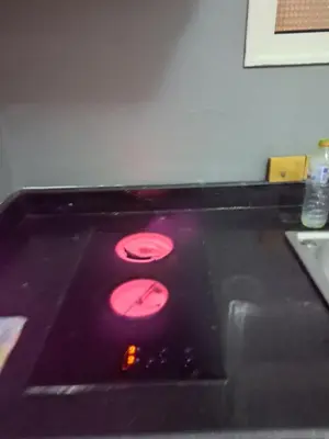 a sink with three red lights in a room at Studio in elkarma resort & aqua park in Hurghada