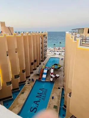 an overhead view of a swimming pool at the beach at Hurghadiansrealty in Hurghada