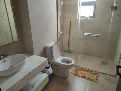 a bathroom with a shower and a toilet and a sink at Stay at elgouna with private heated pool villa in Hurghada