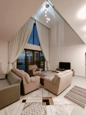 a large living room with couches and a tv at Stay at elgouna with private heated pool villa in Hurghada