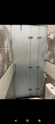 a shower stall in a bathroom with a toilet at City centre Nile Breeze Aswan in Aswan