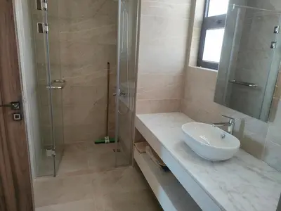a bathroom with a sink and a glass shower at Ancient Sand villa at Elgouna with private heated pool in Hurghada