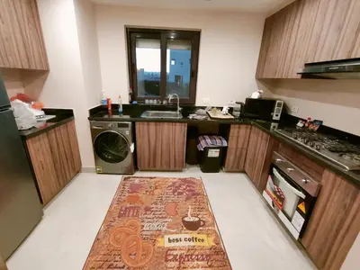 a small kitchen with a sink and a dishwasher at Ancient Sand villa at Elgouna with private heated pool in Hurghada
