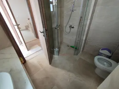 a bathroom with a shower and a toilet at Ancient Sand villa at Elgouna with private heated pool in Hurghada