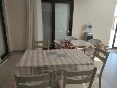 a table and chairs in a room with a table and a table and a table at Ancient Sand villa at Elgouna with private heated pool in Hurghada