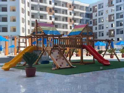 a playground with a slide and a slideintend at Tiba Golden Down Town in Hurghada