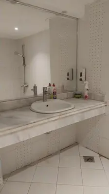 a bathroom with a sink and a mirror at Palma Resort A155 Chalet Hurghada in Hurghada