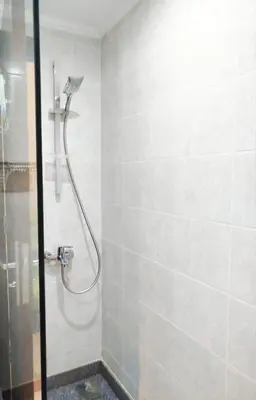a shower with a glass door in a bathroom at Tranquil escape in Hurghada