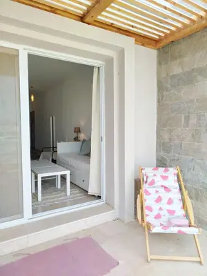 a living room with a couch and a chair at Tranquil escape in Hurghada