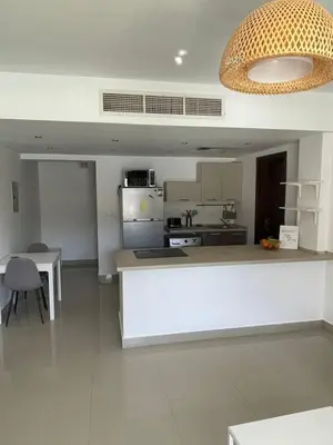 a kitchen with a white counter top in a room at GCribs in Hurghada