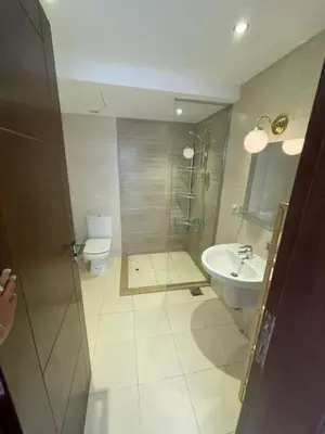 a bathroom with a shower and a toilet and a sink at GCribs in Hurghada