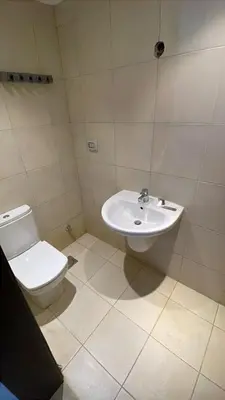 a bathroom with a toilet and a sink at GCribs in Hurghada