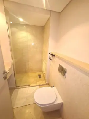 a bathroom with a toilet and a shower at Mangrove Elgouna in Hurghada