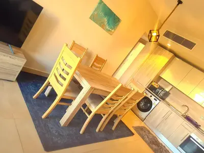 a dining room with a table and two chairs at Mangrove Elgouna in Hurghada