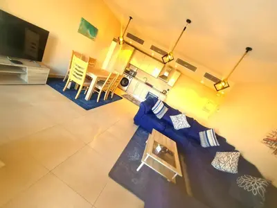 an overhead view of a living room with a blue couch at Mangrove Elgouna in Hurghada