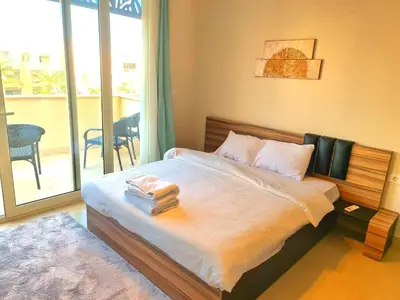 a bedroom with a bed with towels on it at Mangrove Elgouna in Hurghada