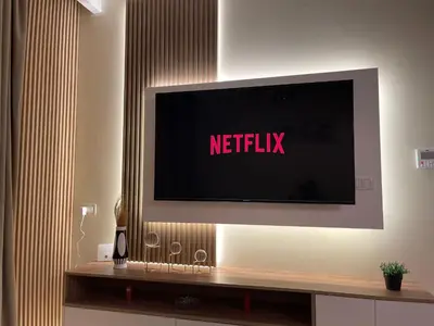 a television on a wall with the netflix sign on it at Hurghada Stylish Heaven Luxury Apartment in Hurghada