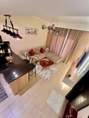 a living room with a couch and a table at Hurghada Stylish Heaven Luxury Apartment in Hurghada