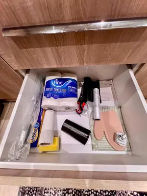 a drawer filled with cleaning products and other items at Hurghada Stylish Heaven Luxury Apartment in Hurghada