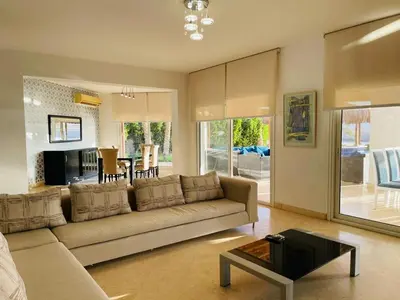 a living room with a couch and a table at 5 bedroom villa with private pool at el gouna in Hurghada