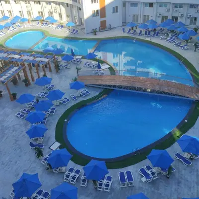 an overhead view of a pool with chairs and umbrellas at Golden Tayeb Hurghada Compound in Hurghada