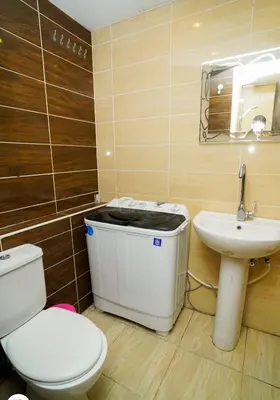 a bathroom with a toilet and a sink at Florenze Khamsin Hurghada in Hurghada
