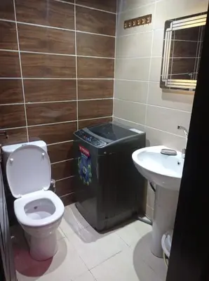 a bathroom with a toilet and a sink at Florenze Khamsin Hurghada in Hurghada