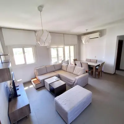a living room with a couch and a table at 2 Bedrooms First floor in Waterside Residence in Hurghada