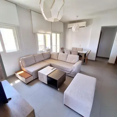 a living room with a couch and a table at 2 Bedrooms First floor in Waterside Residence in Hurghada
