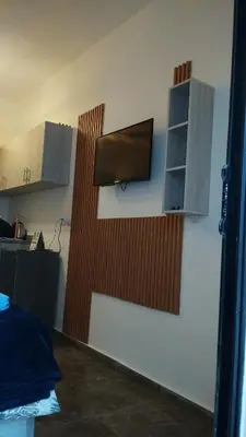 a room with a tv on a wall with aventoryventoryventoryventory at Studiowohnung Aqua Infinity in Hurghada