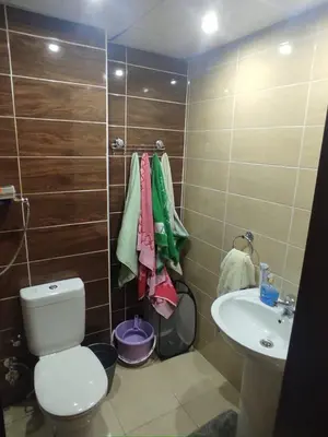 a bathroom with a toilet and a sink at Florenza Khamsin Resort compound in Hurghada