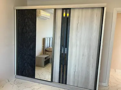 a large mirror in a living room with a room at Hurghada Fanadir Bay in Hurghada