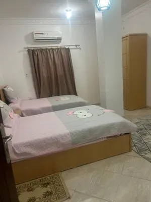 a bedroom with two beds in a room at H&H Twin Apartment in Hurghada