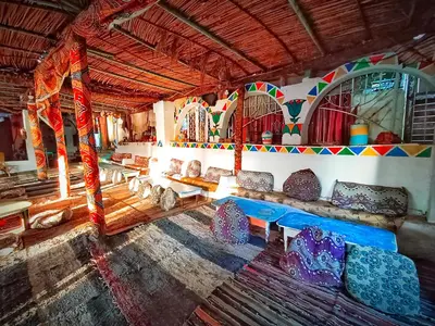 a room with couches and chairs in a building at Fox Nubian Hotel in Aswan
