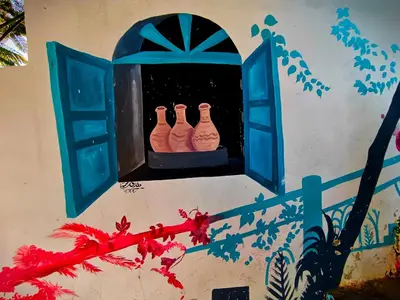 three vases sitting on a window sill at Fox Nubian Hotel in Aswan