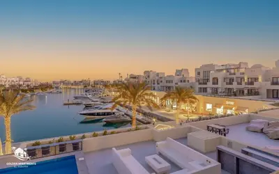 a view of a marina with boats in the water at Relaxing 3BR Fanadir Marina Home l El Gouna Red Sea l Lagoon Views in Hurghada