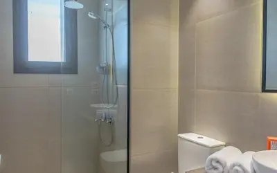 a bathroom with a shower and a toilet and a sink at Relaxing 3BR Fanadir Marina Home l El Gouna Red Sea l Lagoon Views in Hurghada