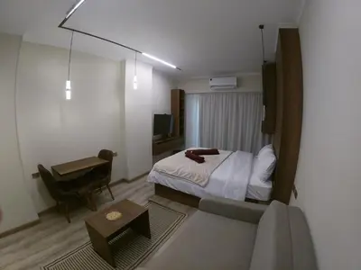 a hotel room with a bed and a desk at Dive Hostel Hurghada Beach in Hurghada