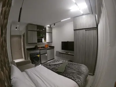 a small room with a bed and a kitchen at Dive Hostel Hurghada Beach in Hurghada