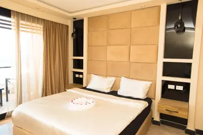 a bedroom with a bed with a cake on it at Palmen Villa in Hurghada