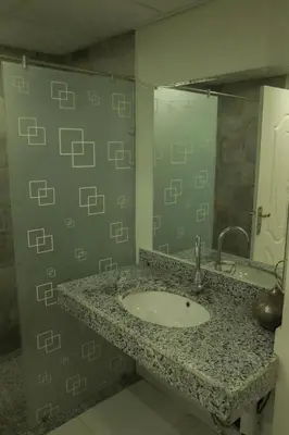 a bathroom with a sink and a mirror at Angeli Apartment Scandic Rezort in Hurghada