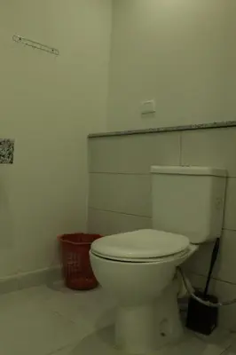 a bathroom with a white toilet in a room at Angeli Apartment Scandic Rezort in Hurghada