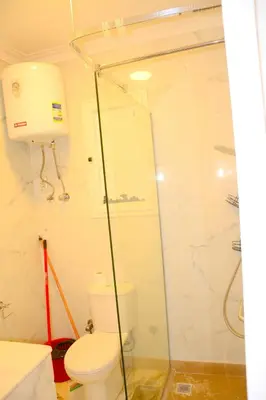 a bathroom with a toilet and a shower at GoEgypt Dreams in Hurghada