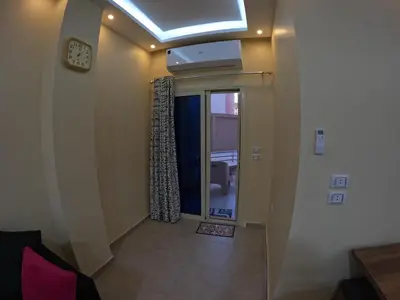a hallway with a room with a window and a ceiling at Hurghada Princess resort, Private Sandy Beach & 3 Pools in Hurghada